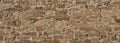 Texture of a stone brown wall of an ancient fortress Royalty Free Stock Photo