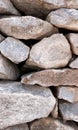 texture of the stone dry wall of shaped stones front view background