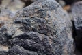 The texture of the stone frozen, petrified lava in a volcano in the mountains 2