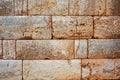 Texture of a stone wall made of large blocks. Elements of the building of ancient antiquity