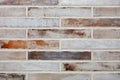 Texture of a stone wall made of old long bricks