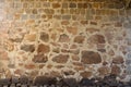 Texture of a stone wall with many big brown and grey stones armed with cement. Old castle stone wall texture background for Royalty Free Stock Photo