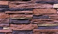 Texture of the stone wall. Panel of stones for finishing the facade of the building and interior design of the house. Background Royalty Free Stock Photo