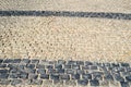 Texture of a stone wall, roads from stones, bricks, cobblestones, tiles with sandy seams of gray ancient . The background Royalty Free Stock Photo
