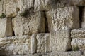 Texture of the stones with notes inserted in crevices of the Western Wall