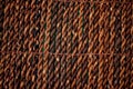 Texture straw design wicker brown rug. Close