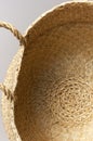 Texture of straw weaving closeup. Straw wicker basket. Fashionable bamboo basket, stylish interior item, eco design, handmade.