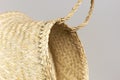 Texture of straw weaving closeup. Straw wicker basket. Fashionable bamboo basket, stylish interior item, eco design, handmade.