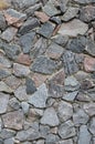 The texture of a strong stone wall of many concreted stones of various shape Royalty Free Stock Photo