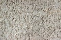 Texture of the structure of the concrete surface with fractions of small stones close-up Royalty Free Stock Photo