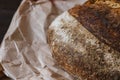Texture surface of baked bread crust on craft package. Beautiful crispy bread close-up. Selective focus. Royalty Free Stock Photo