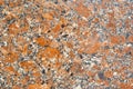 Texture - the surface of a granite slab with orange impregnations Royalty Free Stock Photo