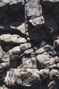 texture of surface of gray rocky mountain with cracks close-up Royalty Free Stock Photo