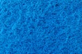 Texture of a surface of intertwined blue threads, abrasive of a synthetic fiber, abstract background