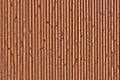 The texture of the surface of the wooden planks. Background of the ceiling cladding planks. Smooth boards with knots