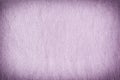 Texture of a terry towel lilac towel close-up. Blank light background with vignette. Royalty Free Stock Photo