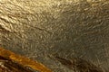 Texture of a thin crumpled sheet of foil. Crumpled foil background. Stock photo foil. Gold chrome color Royalty Free Stock Photo