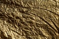 Texture of a thin crumpled sheet of foil. Crumpled foil background. Stock photo foil. Gold chrome color Royalty Free Stock Photo