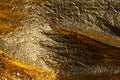 Texture of a thin crumpled sheet of foil. Crumpled foil background. Stock photo foil. Gold chrome color Royalty Free Stock Photo