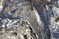 Texture of a thin crumpled sheet of foil. Crumpled foil background. Stock photo foil. Silver chrome color