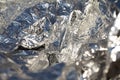 Texture of a thin crumpled sheet of foil. Crumpled foil background. Stock photo foil. Silver chrome color
