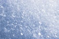 Texture of toned freshly fallen snow. Christmas template for design. Clearly visible individual snowflakes. Royalty Free Stock Photo