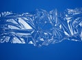 Texture of a transparent stretching plastic film for packaging products on a blue background Royalty Free Stock Photo