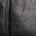 The texture of the two stitched halves of soft black leather Royalty Free Stock Photo