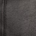 The texture of the two stitched halves of soft black leather Royalty Free Stock Photo