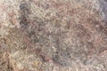 Texture of an uneven surface of a stone, a rock in natural natural conditions, a close-up Royalty Free Stock Photo