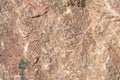 Texture of an uneven surface of a stone, a rock in natural natural conditions, a close-up Royalty Free Stock Photo