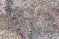 Texture of an uneven surface of a stone, a rock in natural natural conditions, a close-up Royalty Free Stock Photo