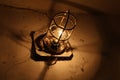 Old industrial lamp in an abandoned basement. Royalty Free Stock Photo