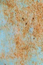 Rusty, scratched metal sheet with flaking and faded paint Royalty Free Stock Photo