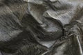 Texture of used tar paper from roof as background Royalty Free Stock Photo
