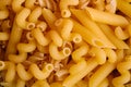 Texture of variety uncooked golden wheat pasta background