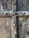 Texture of vertical mahogany old wood with cross beam,detail of a wooden door background.Old wood panel background. Rough wooden Royalty Free Stock Photo