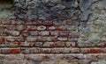 Texture of a very old peeling red brick wall covered with plaster closeup. time breaking background Royalty Free Stock Photo