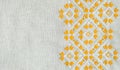 Texture of the vintage homespun linen textile with embroidery. Design of ethnic pattern. Craft embroidery.