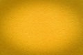 Texture of vintage paper golden gradient background with dark vignette. Structure of craft yellow cardboard with frame Royalty Free Stock Photo