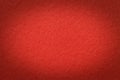 Texture of vintage red paper gradient background with dark vignette. Structure of craft ruby cardboard with frame Royalty Free Stock Photo