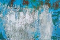 Texture of vintage rusty blue and gray iron wall background with many layers of paint