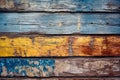 Texture of vintage wooden boards with cracked yellow and blue paint