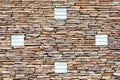 The texture of the wall is lined with sandstone with an ornament of silicate bricks Royalty Free Stock Photo