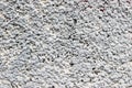 Texture of a wall made of crushed stone plastered with cement. Rock dash stucco used as an exterior coating on a house wall Royalty Free Stock Photo