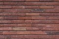 Texture of a wall made of old raw bricks. The walls are deep red. Royalty Free Stock Photo