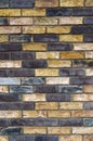 The texture of the wall from the new gray-yellow bricks. Royalty Free Stock Photo