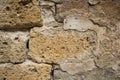 Texture of a wall of old tuff bricks