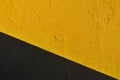 Texture of the wall painted in black and yellow geometric areas Royalty Free Stock Photo