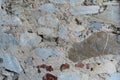The texture of the wall with various patches of marble, granite, brick Royalty Free Stock Photo